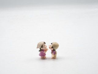 White isolated on background copy space empty texture frame The pink Valentine male and female doll toy  is facing and kissing.Is mean girlfriend boyfriend loverheart letter the happy valentine 14 