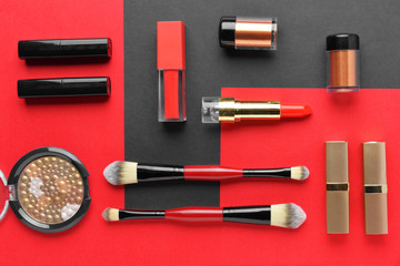 Set of decorative cosmetics and accessories on color background