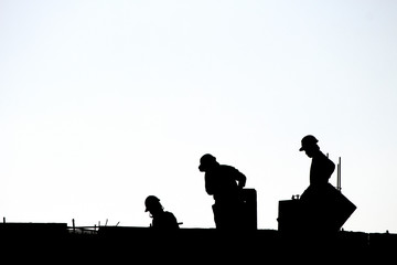 Fototapeta na wymiar Silhouette workers under construction and construction site.