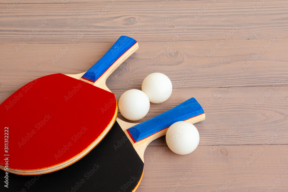 Poster ping pong equipment on wooden table close up