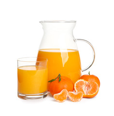 Jug and glass of tangerine juice with fruits isolated on white