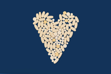 White medical pills on classic blue color background