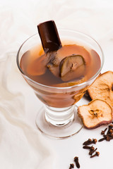 Dried fruits compote in glass on white