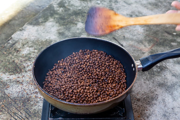 Traditional roasting coffee at home,  freshly roasted coffee beans.