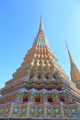 Phra Maha Chedi Si Rajakarn,This is a group of four large stupas, each 42 metres high,These four chedis are dedicated to the first four Chakri kings,Ornamental tile