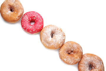 Sweet tasty donuts on white background