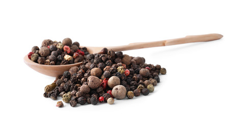 Pepper grains mix and wooden spoon isolated on white
