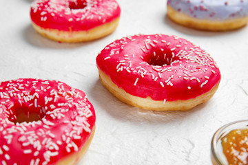 Sweet tasty donuts on white background