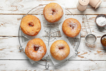 Sweet tasty donuts on table
