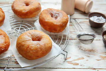 Sweet tasty donuts on table