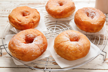 Sweet tasty donuts on table