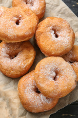 Sweet tasty donuts on table