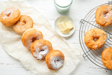 Sweet tasty donuts on table