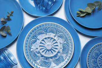 Flat lay composition inspired by color of the year 2020  (Classic blue) on white background