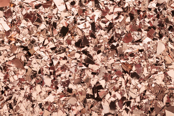 Pink Gold glitter foil confetti background. Festive, party or holiday backdrop. Flat-lay, close-up.