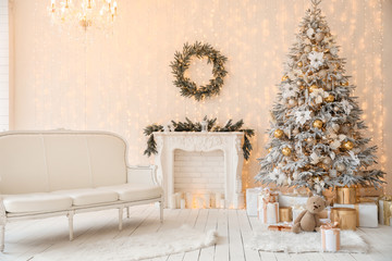 Stylish interior of living room with beautiful Christmas tree and fireplace