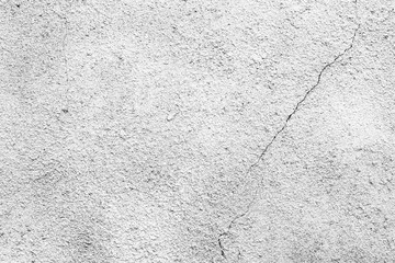 Texture of a concrete wall with cracks and scratches which can be used as a background