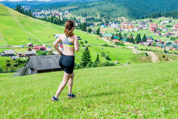 Healthy lifestyle woman trail runner running on mountain peak.