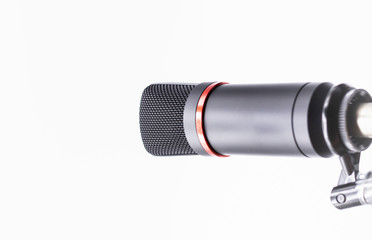 Sound studio. Microphone with cable isolated on bright  background