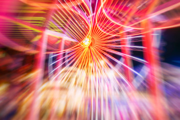 spinning carousel at amusement park.night time