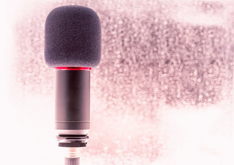 Sound studio. Microphone with cable isolated on bright  background