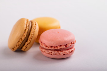 delicious colorful macaroons on gray background