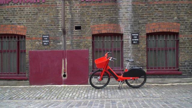 JUMP Uber electric bicycle sharing scheme. Bike parked on a London street waiting for the next customer to hire it via the Uber app.