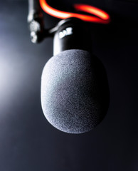 Naklejka na ściany i meble Sound studio. Microphone with cable isolated on black background