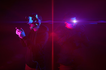 Man with virtual reality headset and gamepad and his virtual gaming avatar. Image with glitch effect.
