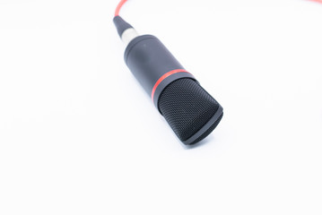 Sound studio. Microphone with cable isolated on white background