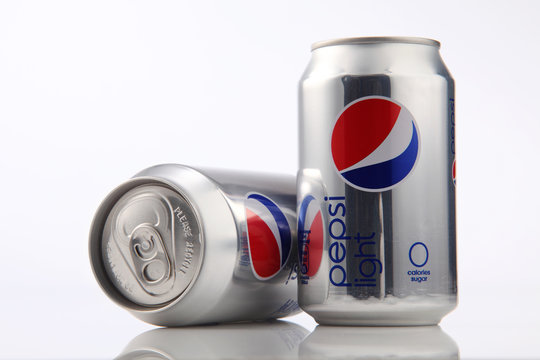 two can of pepsi light on white background