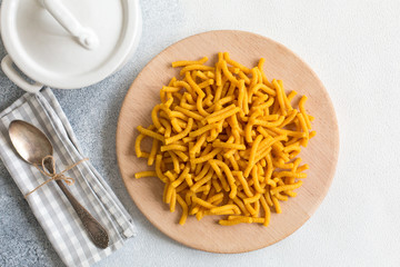 Raw Passatelli - a pasta formed of bread crumbs, eggs, grated Parmesan cheese. Typical for Pesaro, Urbino and Emilia  Romagna. Uncooked