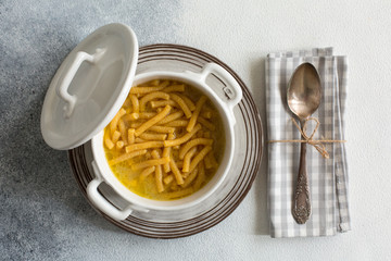 Passatelli in brodo - passatelli in broth - pasta cooked in chicken broth. A pasta formed of bread...