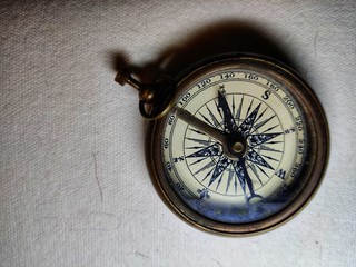 Fototapeta na wymiar Compass on an old paper