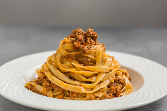 Tagliatelle al ragù alla Bolognese - long, flat egg pasta with a meat sauce or Bolognese sauce.