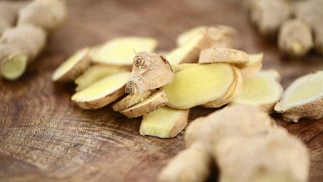 Portion of Ginger on a rotating vintage wooden plate as seamless loopable 4K footage (seamless loopable)