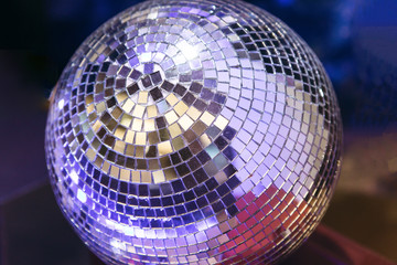 Mirrored glowing disco ball. Retro disco or decoration