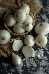 Onions on textured background. Food Ingredients.