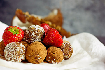 Raw food dessert balls made of dates and nuts. Homemade sweets without sugar and gluten, proper nutrition, vegan sweets