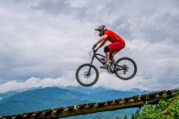 Professional athlete high jump on a mountain bike.