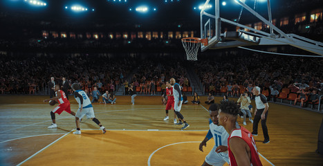 Fototapeta premium Basketball players on big professional arena during the game. Tense moment of the game. Celebration