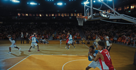 Fototapeta premium Basketball players on big professional arena during the game. Tense moment of the game. Celebration