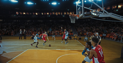 Fototapeta premium Basketball players on big professional arena during the game. Tense moment of the game. Celebration