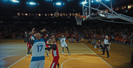 Fototapeta premium Basketball players on big professional arena during the game. Tense moment of the game. Celebration