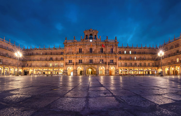 Salamanca, Spain. View of Plaza Mayor at dusk - 18th-century Spanish baroque public square bordered by shops, restaurants and Town Hall. - obrazy, fototapety, plakaty