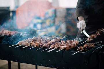 Juicy lamb skewers on the open barbecue. Street food.