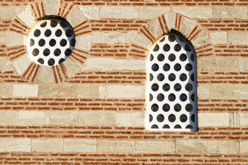  small window in an old brick building