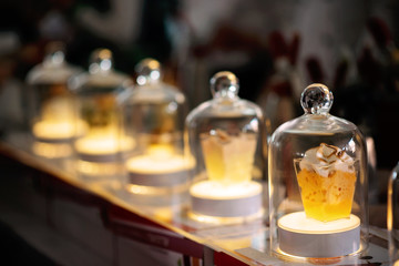 Fototapeta na wymiar A spectacular presentation of molecular cuisine in a glass flask with backlight.