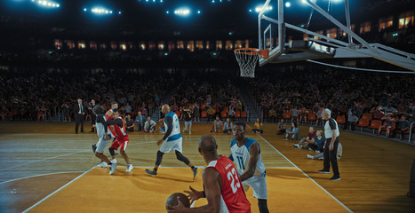 Fototapeta premium Basketball players on big professional arena during the game. Tense moment of the game. Celebration