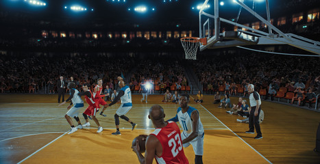 Fototapeta premium Basketball players on big professional arena during the game. Tense moment of the game. Celebration